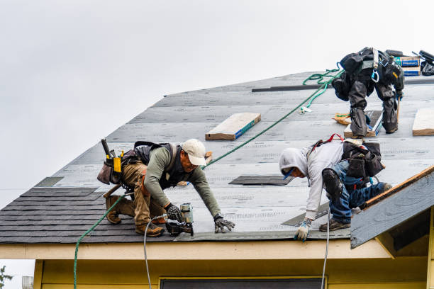 Professional Gutter Installation technician working in Maywood, CA